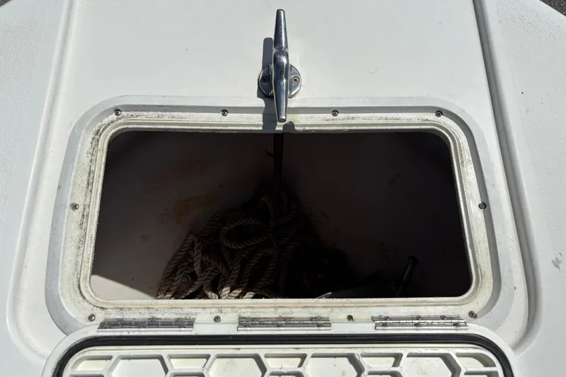 Slide: The Image of Anchor storage compartment on a 2004 Sea Chaser 2300 Offshore boat. - 15