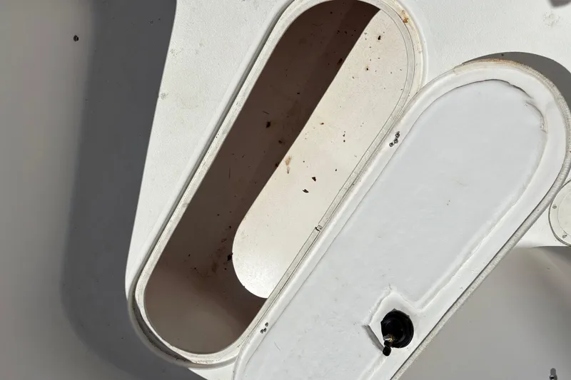 Slide: The Image of Open storage compartment on a 2004 Sea Chaser 2300 Offshore boat. - 16
