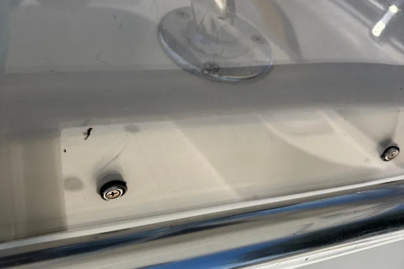 Slide: The Image of Close-up of 2004 Sea Chaser 2300 Offshore boat deck with screws and minor scratches. - 18