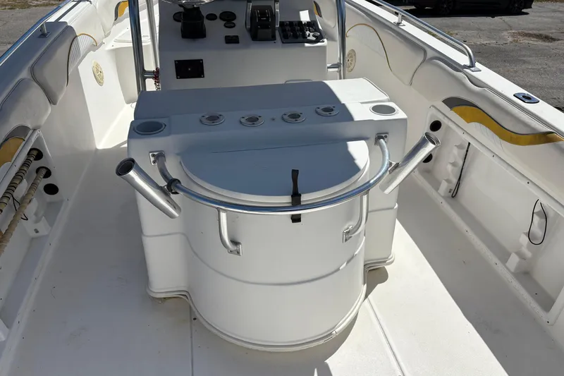 Slide: The Image of 2004 Sea Chaser 2300 Offshore boat interior with helm and seating area. - 5