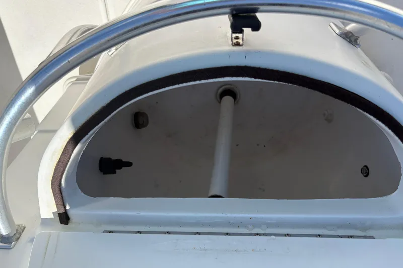 Slide: The Image of 2004 Sea Chaser 2300 Offshore boat compartment with metal railing and open hatch. - 7