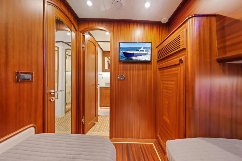 Slide: The Image of Luxurious wood-paneled interior of 2023 Vicem 65 Classic yacht cabin with modern amenities. - 13