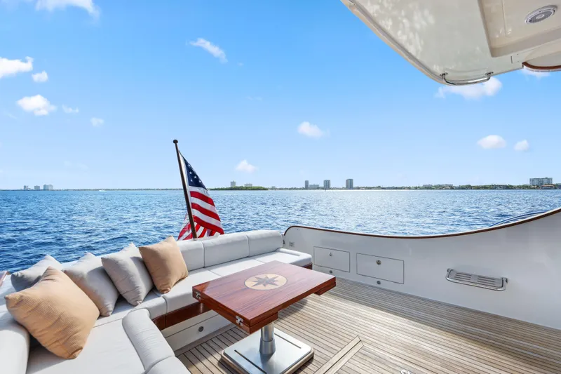 Slide: The Image of 2023 Vicem 65 Classic yacht deck with seating, table, and ocean view. - 14
