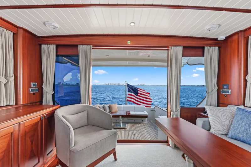 Slide: The Image of Interior of 2023 Vicem 65 Classic yacht with ocean view and American flag. - 19