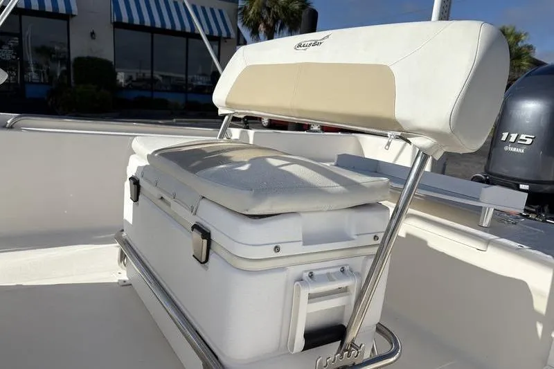 Slide: The Image of 2025 Bulls Bay 2000 boat interior with cushioned seating and storage. - 12