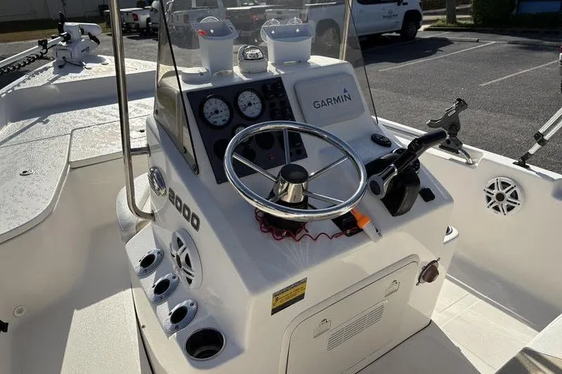 Slide: The Image of 2025 Bulls Bay 2000 boat console with Garmin navigation and steering wheel. - 14