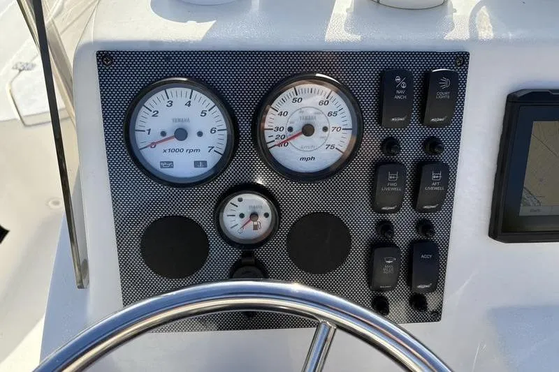 Slide: The Image of Dashboard of 2025 Bulls Bay 2000 boat with gauges and controls. - 15