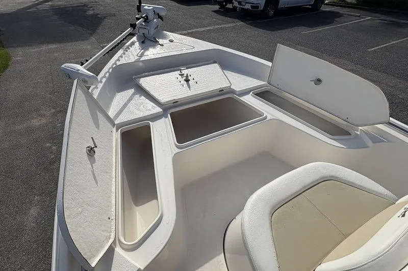 Slide: The Image of 2025 Bulls Bay 2000 boat interior with open storage compartments and seating. - 20