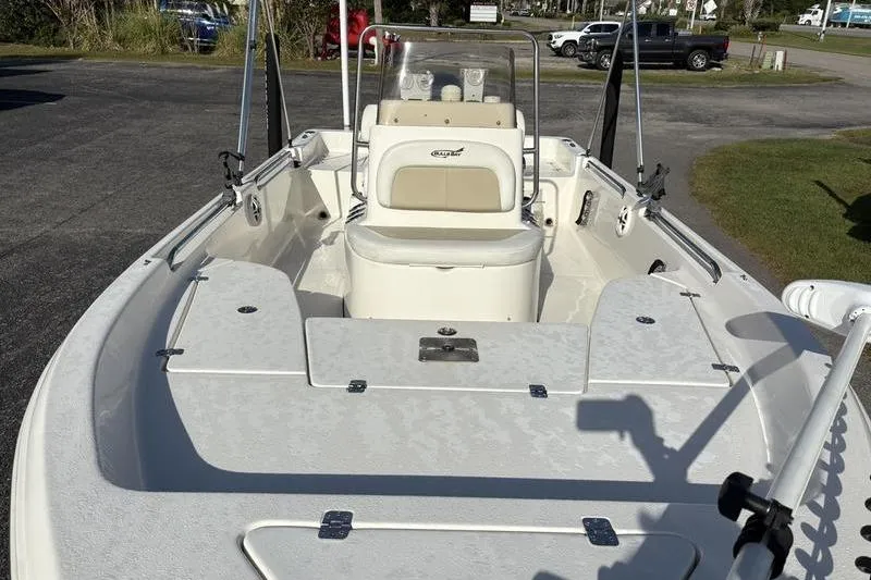 Slide: The Image of 2025 Bulls Bay 2000 boat, white interior, center console, parked outdoors. - 22