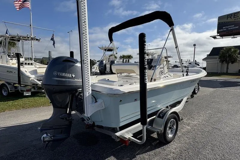 Slide: The Image of 2025 Bulls Bay 2000 boat with Yamaha engine on trailer, parked outdoors. - 3