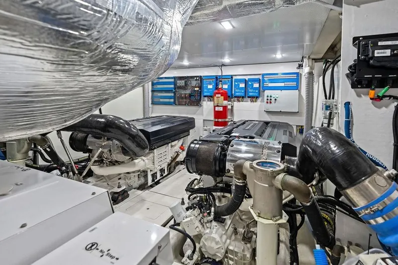 Slide: The Image of Engine room of 2022 Galeon 640 Fly yacht, featuring advanced machinery and control systems. - 104