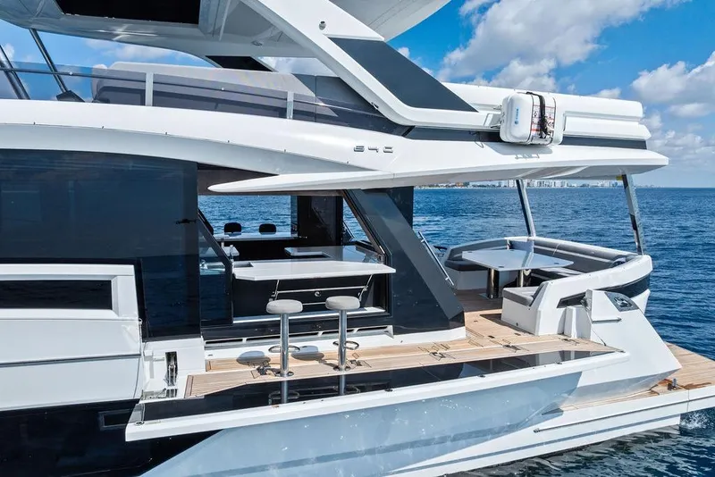 Slide: The Image of 2022 Galeon 640 Fly yacht on open water, showcasing sleek design and luxurious deck. - 11