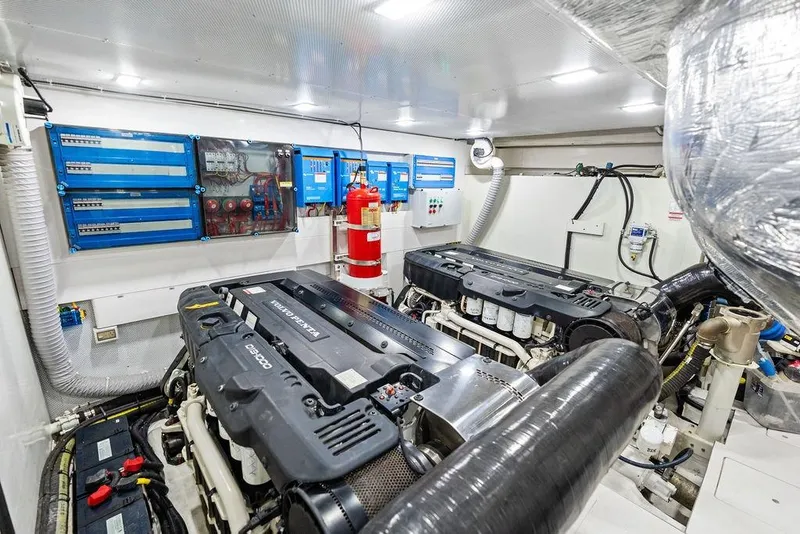 Slide: The Image of Engine room of 2022 Galeon 640 Fly yacht, featuring advanced machinery and control panels. - 111