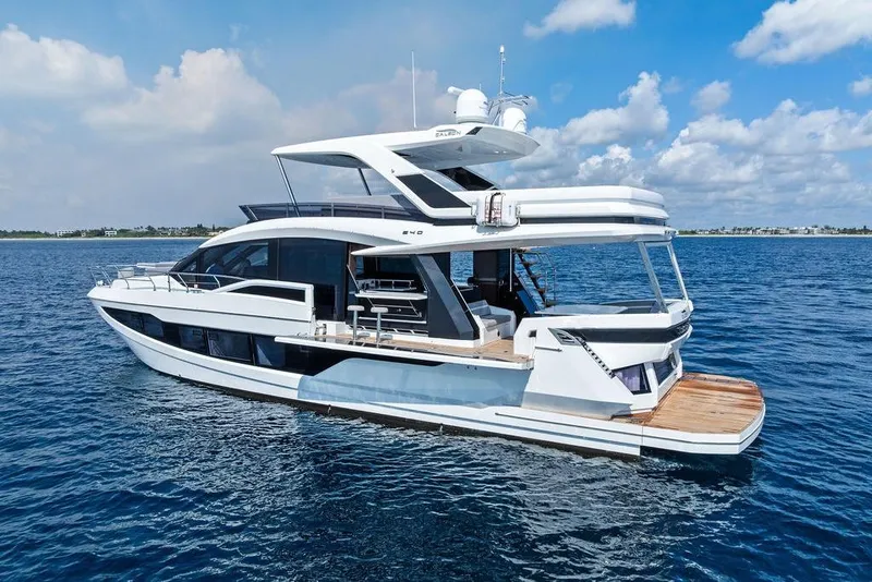 Slide: The Image of 2022 Galeon 640 Fly yacht on open water under a blue sky. - 12