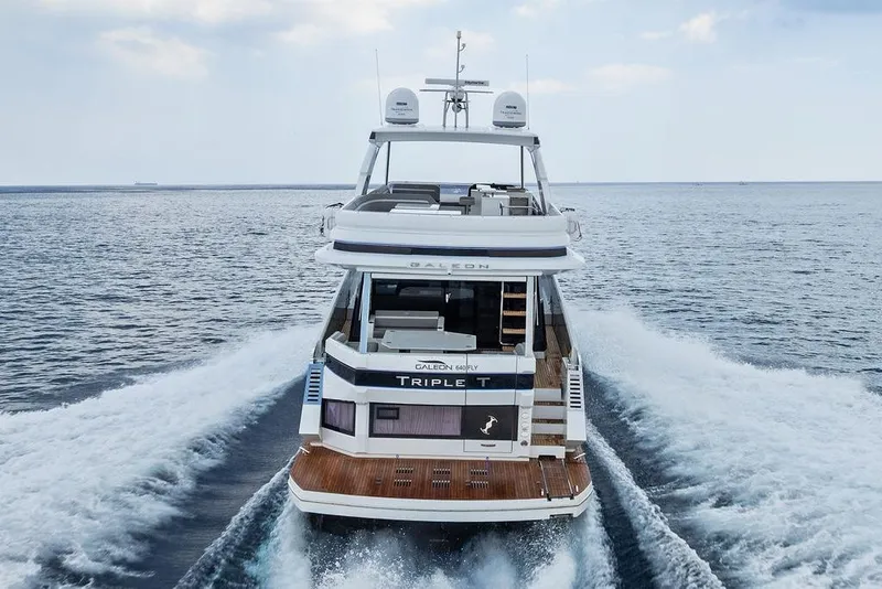 Slide: The Image of 2022 Galeon 640 Fly yacht cruising on open sea, rear view. - 18