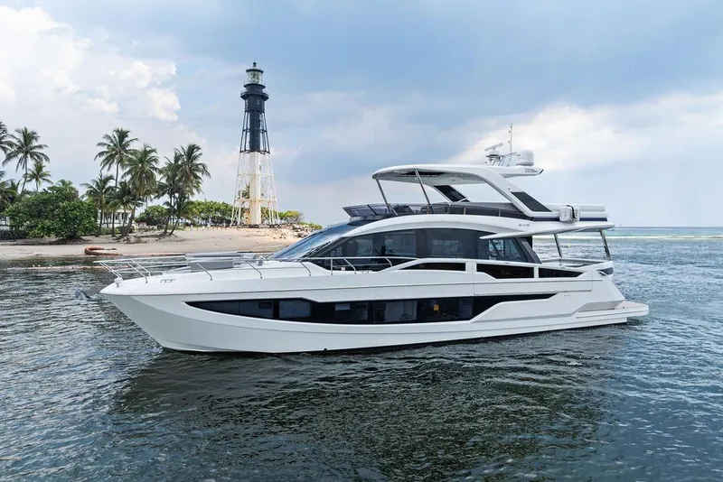 Slide: The Image of 2022 Galeon 640 Fly yacht near a lighthouse and palm trees. - 23