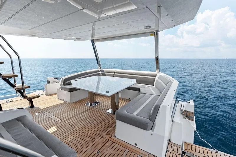 Slide: The Image of Luxurious 2022 Galeon 640 Fly yacht deck with elegant seating and ocean view. - 24