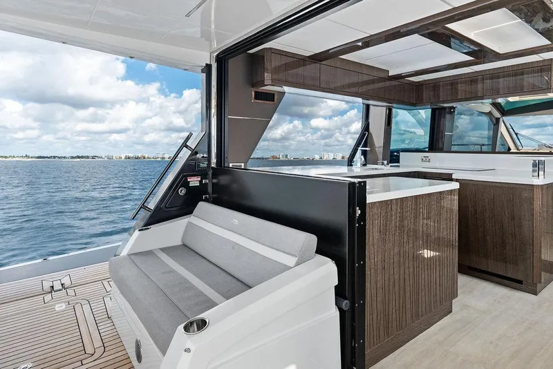 Slide: The Image of Luxurious 2022 Galeon 640 Fly yacht interior with modern seating and ocean view. - 27