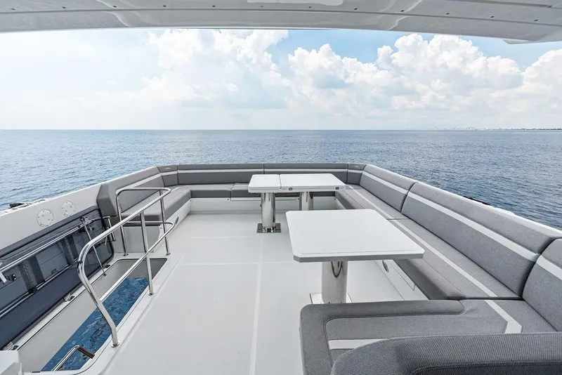 Slide: The Image of Luxurious 2022 Galeon 640 Fly yacht deck with seating, overlooking serene ocean view. - 37