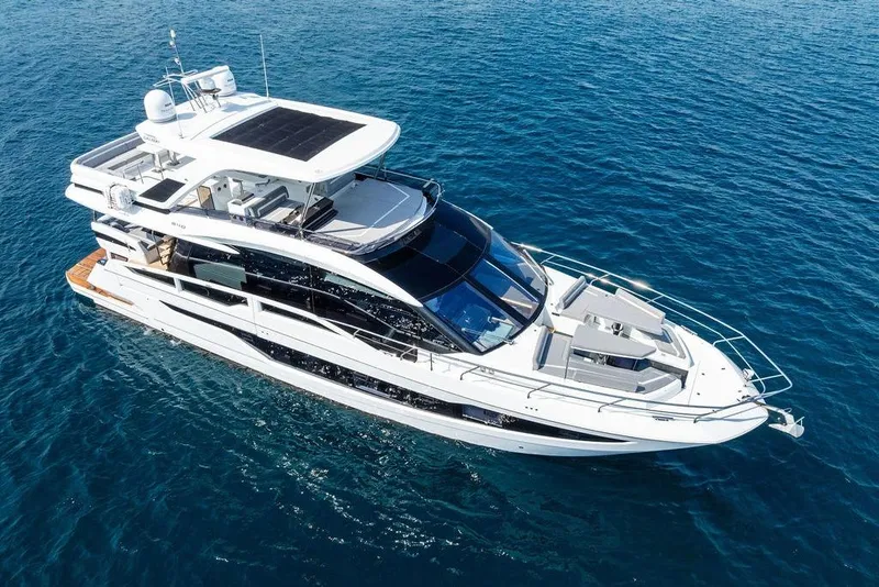 Slide: The Image of 2022 Galeon 640 Fly yacht cruising on open blue waters. - 4