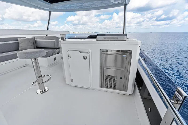 Slide: The Image of Flybridge of 2022 Galeon 640 Fly yacht with seating and ocean view. - 40