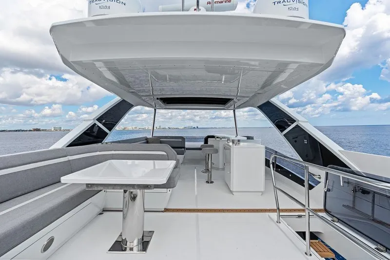 Slide: The Image of Luxurious 2022 Galeon 640 Fly yacht deck with seating and ocean view. - 43