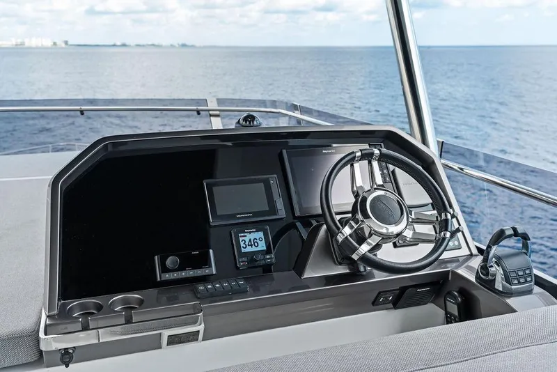 Slide: The Image of Helm of 2022 Galeon 640 Fly yacht with modern navigation equipment and ocean view. - 46