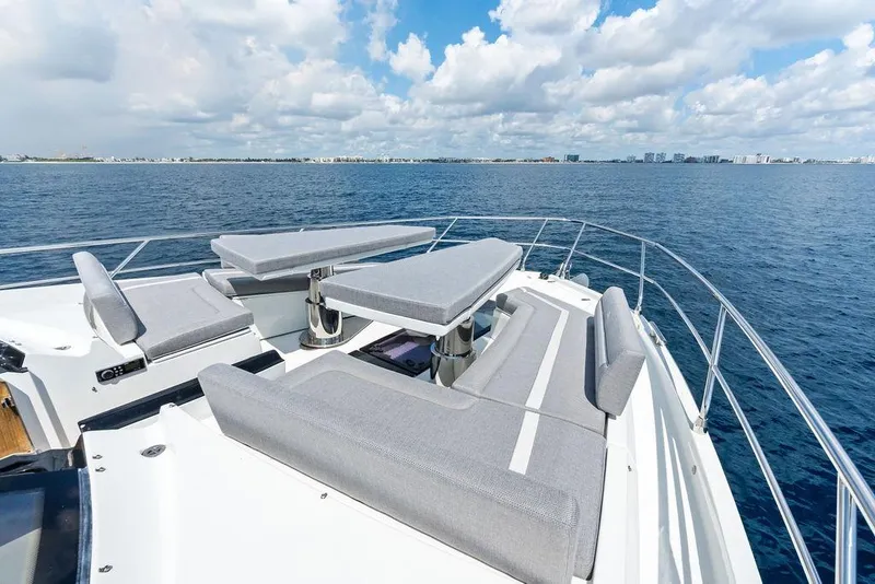 Slide: The Image of Luxurious 2022 Galeon 640 Fly yacht deck with modern seating, ocean view. - 49