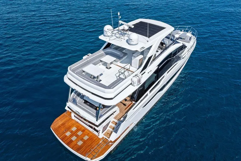 Slide: The Image of 2022 Galeon 640 Fly yacht on open sea, showcasing luxurious design and spacious deck. - 5