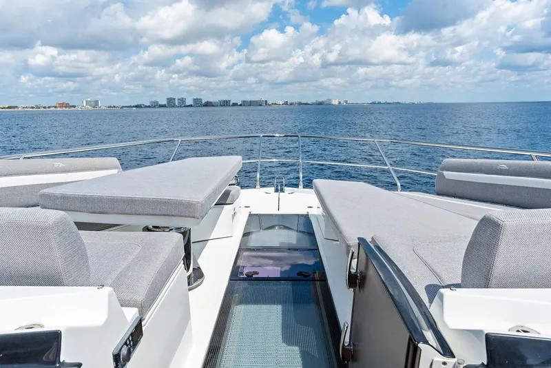 Slide: The Image of Luxurious 2022 Galeon 640 Fly yacht deck with ocean view and city skyline. - 50