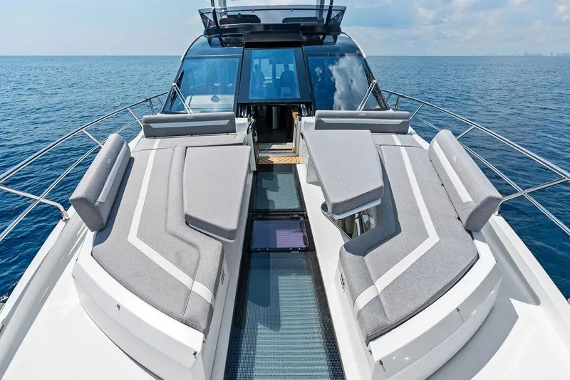Slide: The Image of Luxurious 2022 Galeon 640 Fly yacht with spacious deck and modern seating on open sea. - 51
