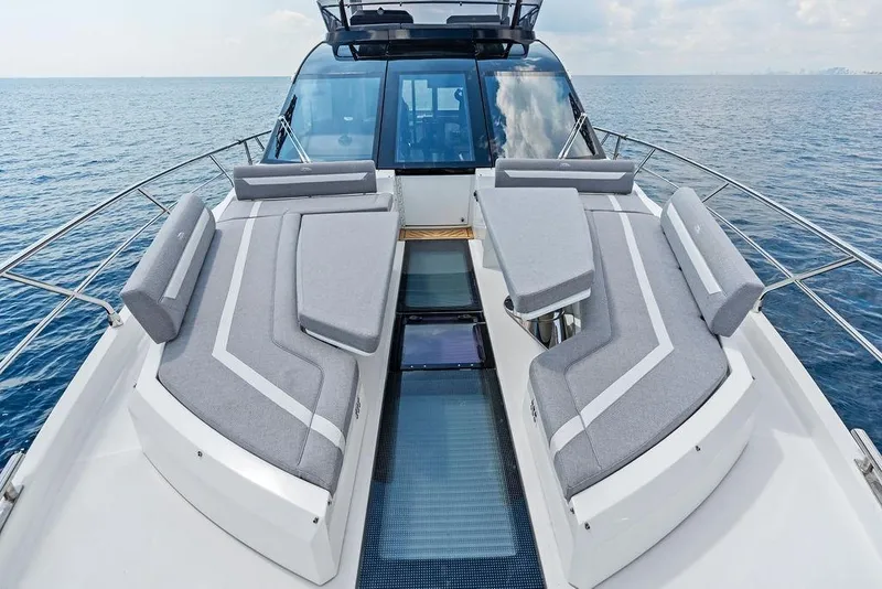 Slide: The Image of Luxurious 2022 Galeon 640 Fly yacht with elegant deck seating on open sea. - 52