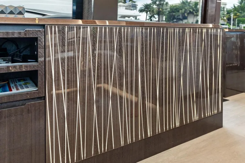 Slide: The Image of Luxurious interior detail of 2022 Galeon 640 Fly yacht with modern wood paneling. - 57