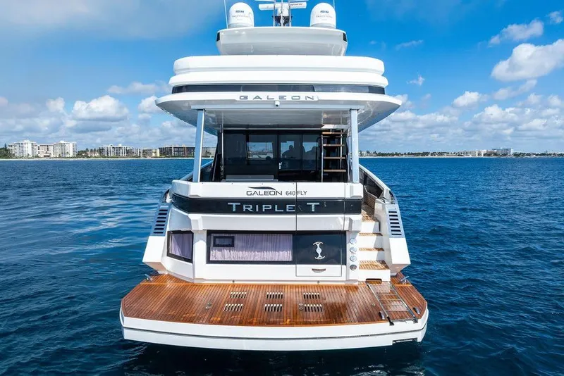 Slide: The Image of 2022 Galeon 640 Fly yacht on open water, rear view with clear sky. - 6