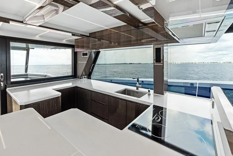 Slide: The Image of Luxurious kitchen interior of 2022 Galeon 640 Fly yacht with ocean view. - 62