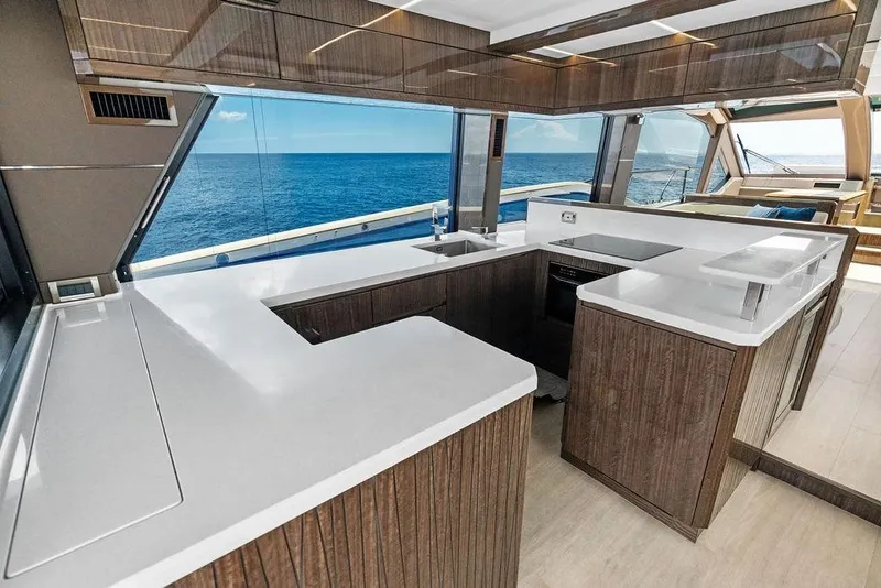 Slide: The Image of Luxurious kitchen interior of 2022 Galeon 640 Fly yacht with ocean view. - 63