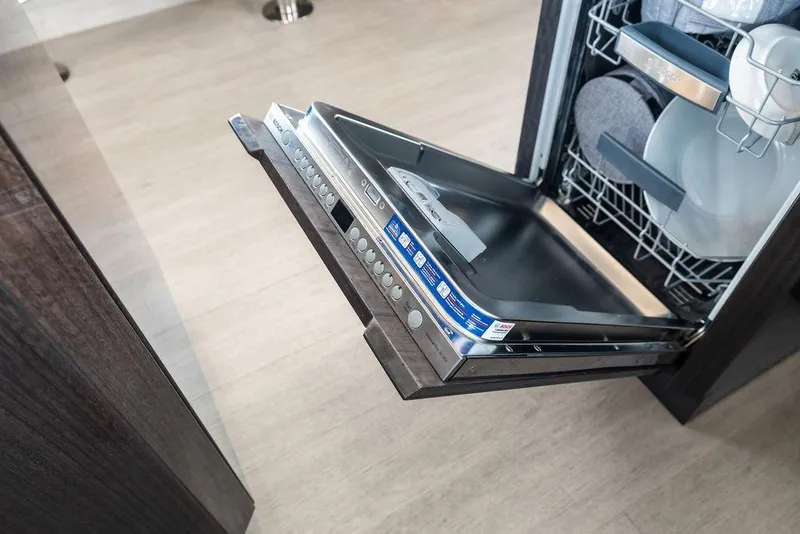 Slide: The Image of Open dishwasher in Galeon 640 Fly yacht, 2022 model, with clean dishes inside. - 65