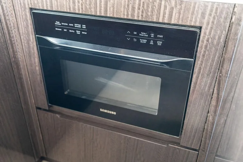 Slide: The Image of Built-in Samsung microwave in 2022 Galeon 640 Fly yacht kitchen. - 68