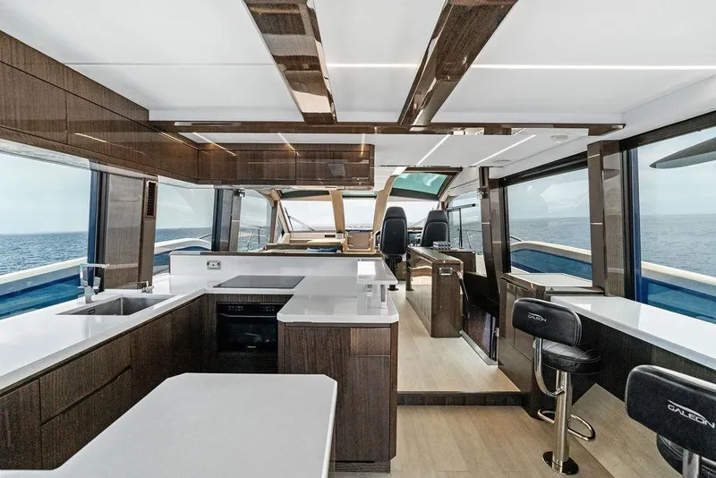 Slide: The Image of Luxurious interior of 2022 Galeon 640 Fly yacht with modern kitchen and ocean view. - 69