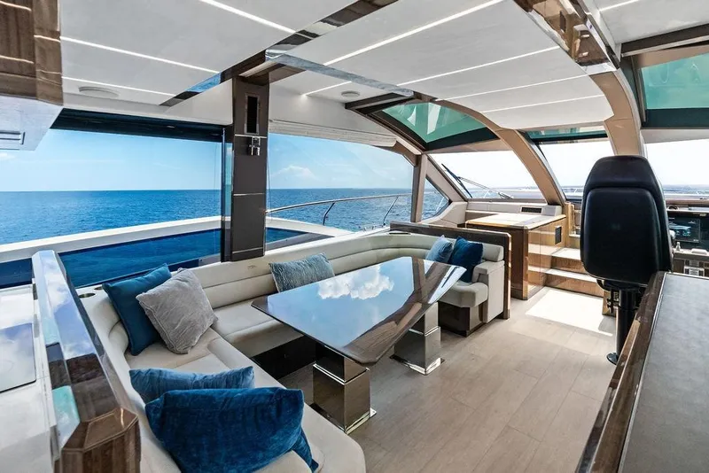 Slide: The Image of Luxurious interior of 2022 Galeon 640 Fly yacht with ocean view and modern seating. - 72