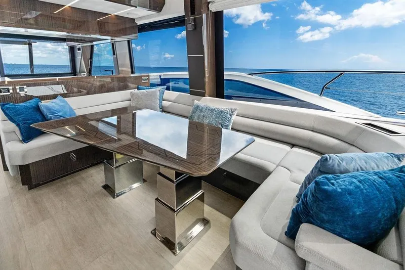 Slide: The Image of Luxurious interior of 2022 Galeon 640 Fly yacht with ocean view and plush seating. - 73