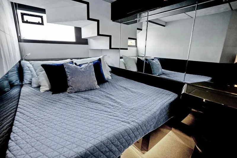 Slide: The Image of Luxurious bedroom interior of 2022 Galeon 640 Fly yacht with modern design and plush bedding. - 90