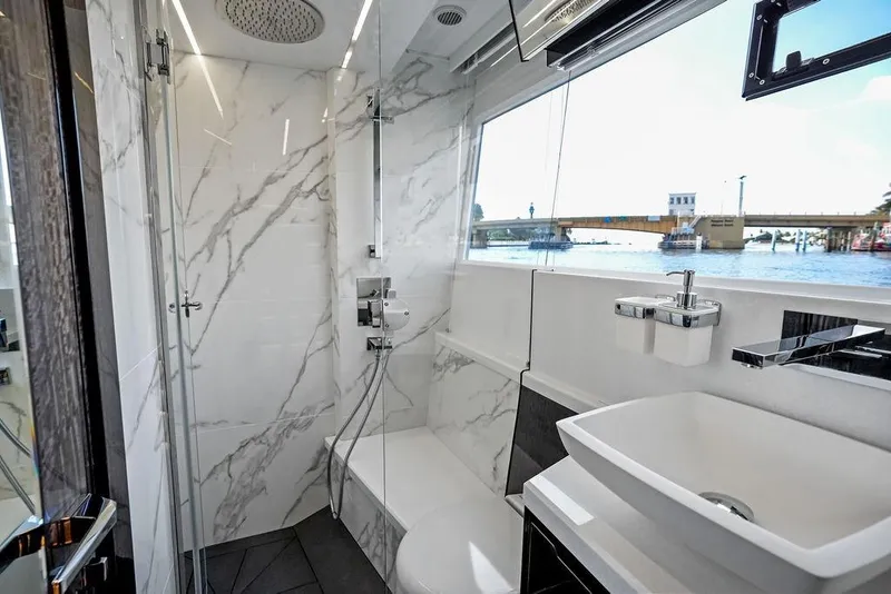 Slide: The Image of Luxurious bathroom on 2022 Galeon 640 Fly yacht with marble accents and waterfront view. - 92