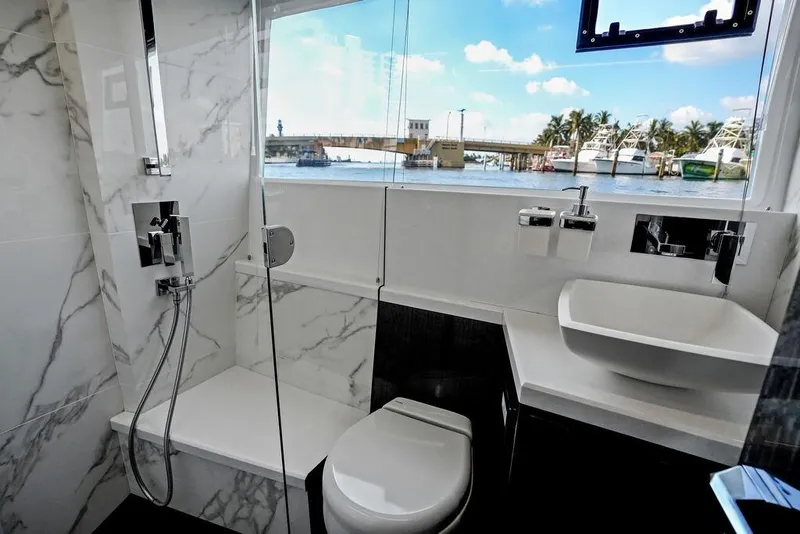 Slide: The Image of Luxurious bathroom on 2022 Galeon 640 Fly yacht with marble accents and ocean view. - 93