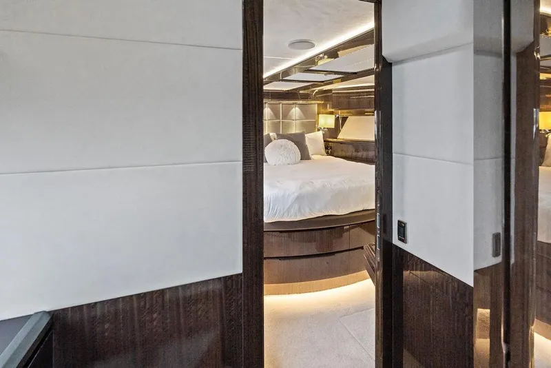 Slide: The Image of Luxurious bedroom interior of 2022 Galeon 640 Fly yacht with modern design and ambient lighting. - 96