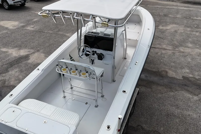 Slide: The Image of 2003 Jupiter 27 boat with center console and T-top on a trailer. - 17