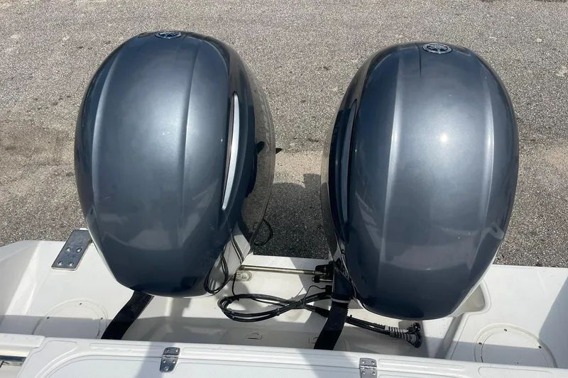 Slide: The Image of Boat dashboard with Raymarine and Garmin displays, Jupiter 27 model, 2003. - 27