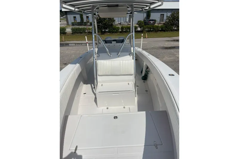 Slide: The Image of 2003 Jupiter 27 boat interior with seating and steering console. - 32