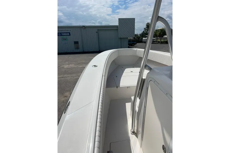 Slide: The Image of Open storage compartment on 2003 Jupiter 27 boat with coiled rope inside. - 36