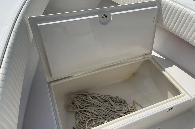 Slide: The Image of Interior of a 2003 Jupiter 27 boat with storage crate and control panel. - 37